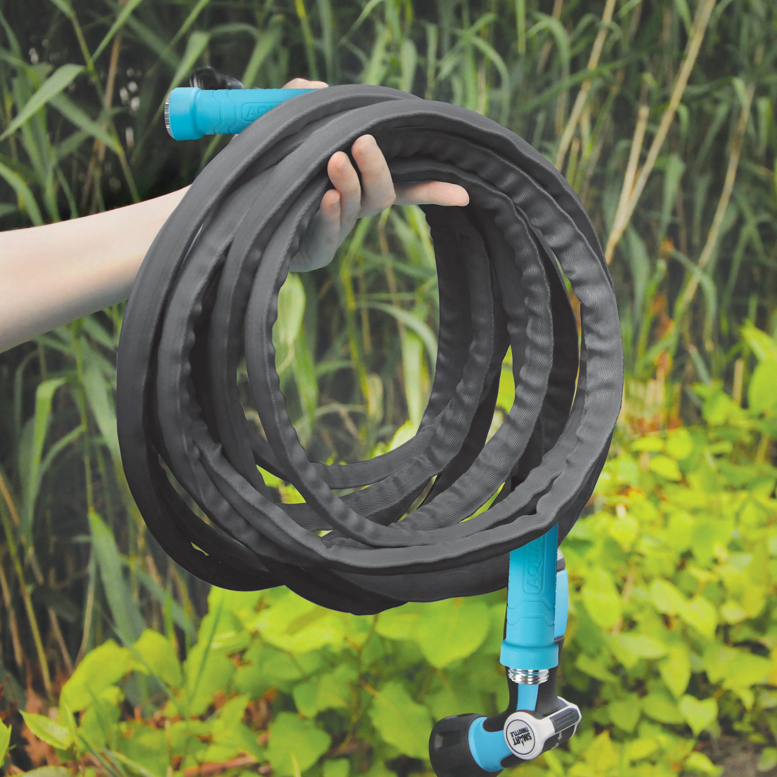 Person holding the Aqua Joe 25-foot FiberJacket Garden Hose.