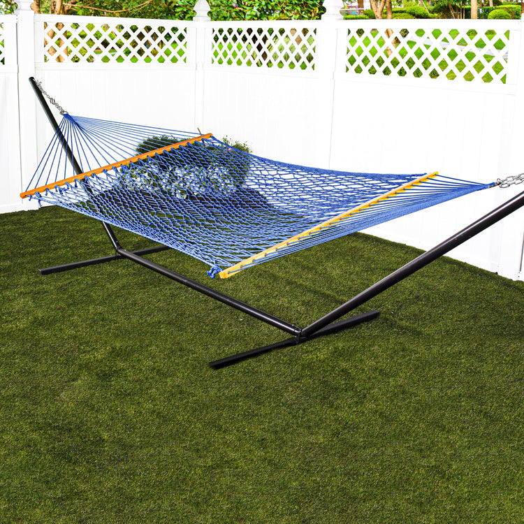 Bliss Hammocks 60-inch Wide Blue Cotton Rope Hammock secured to a stand in a backyard.