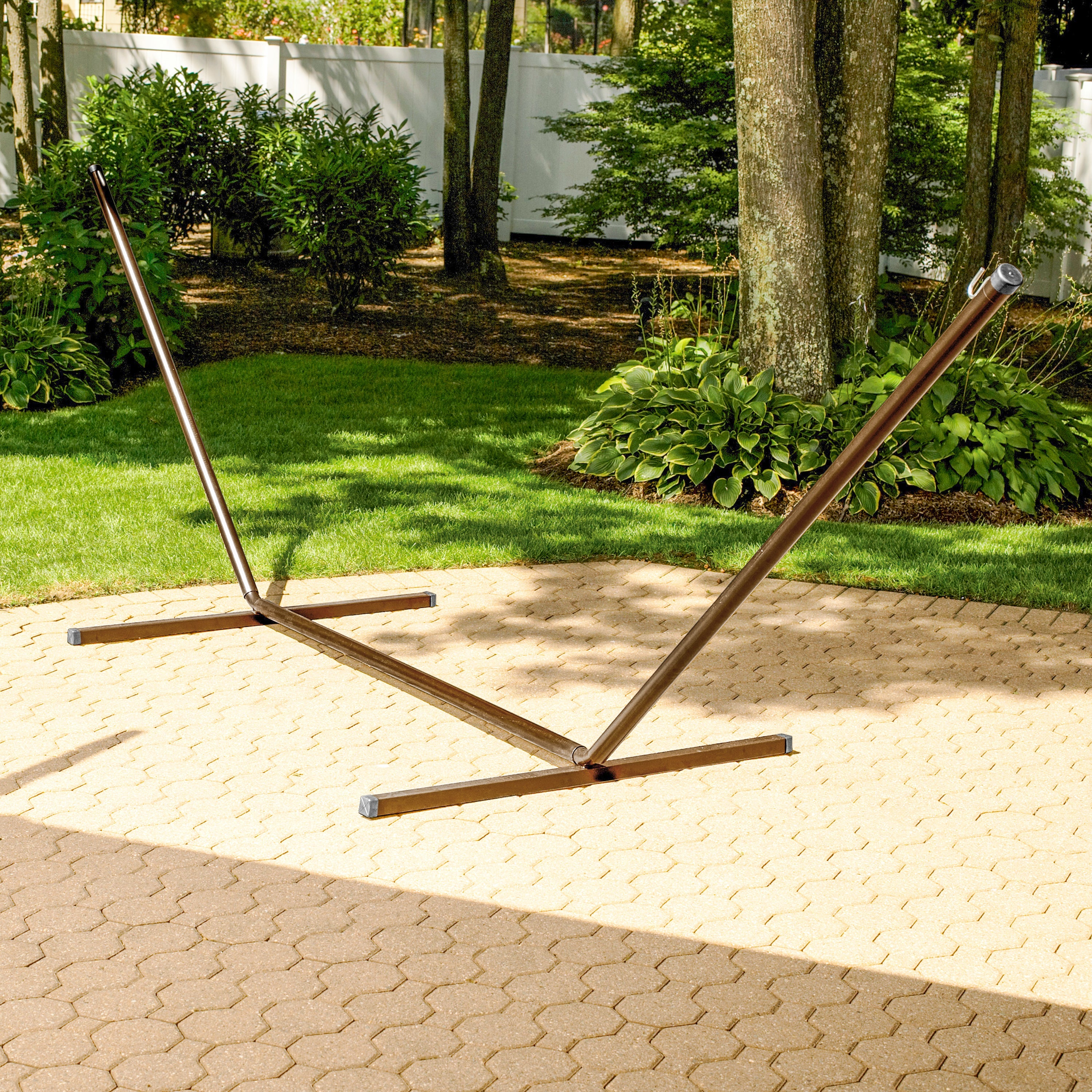 15-foot bronze hammock stand in a backyard.