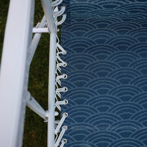 Close-up of the white bungees on the 26-inch Blue Scallop Reclining Sling Chair.