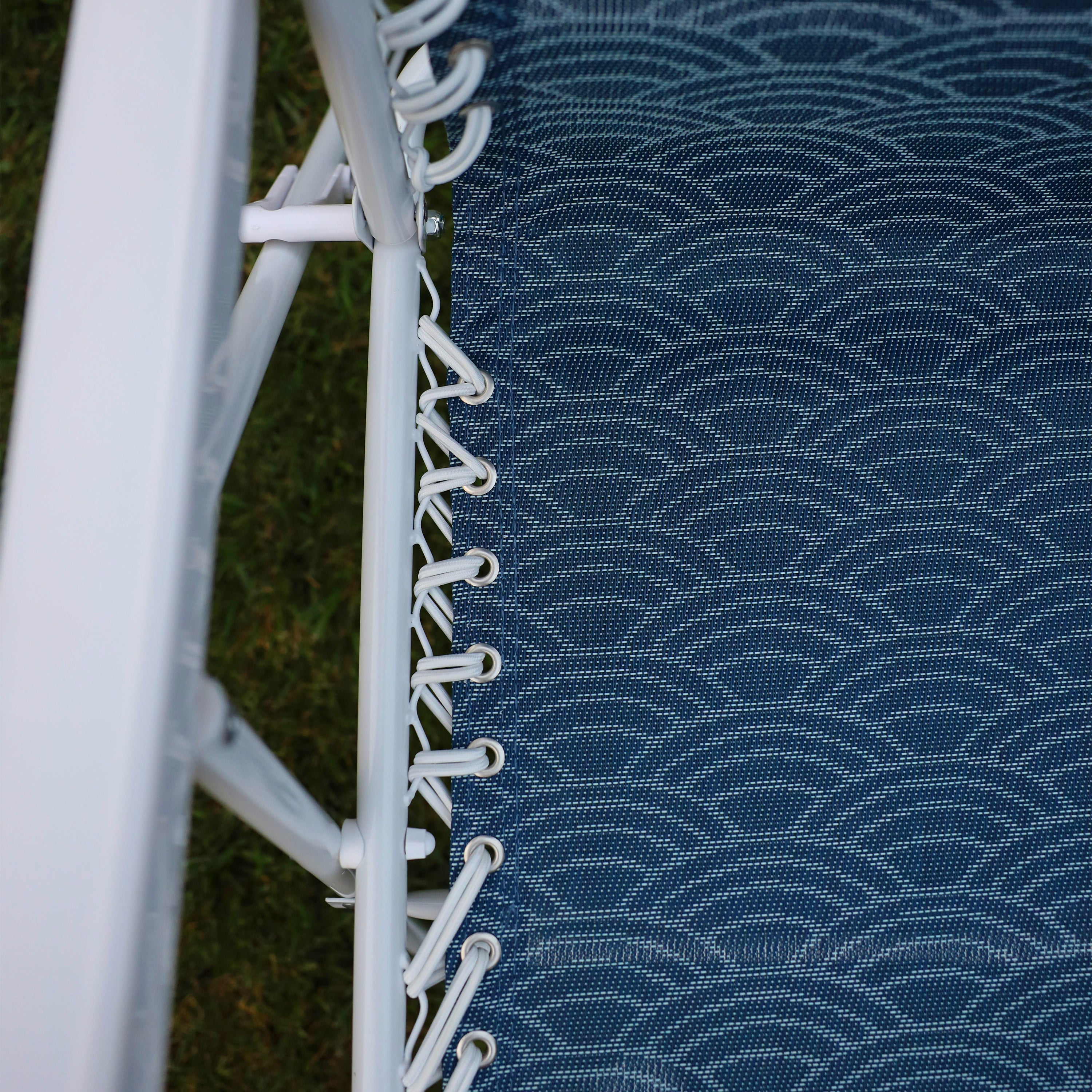 Close-up of the white bungees on the 26-inch Blue Scallop Reclining Sling Chair.