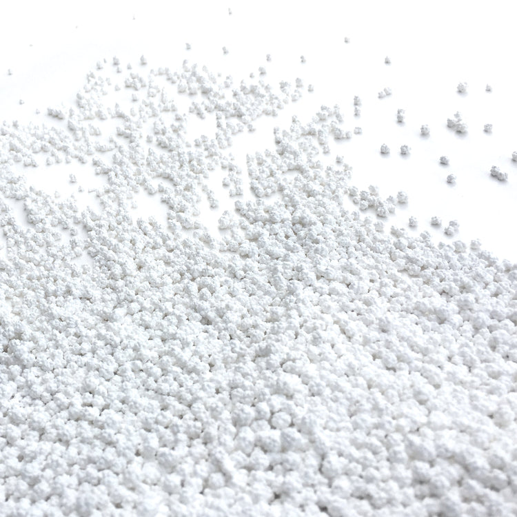Close-up of the Snow Joe Pure Calcium Chloride Ice Melt Pellets.