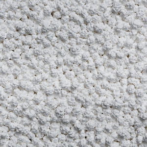 Close-up of the pellets in the Snow Joe Pure Calcium Chloride Ice Melt.