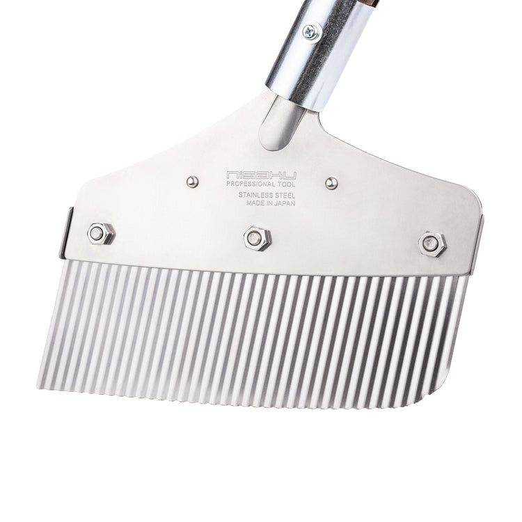 Close-up of the head on the Nisaku Zassou Burush Obake 7.25-inch Stainless Steel Weed Sweeper.