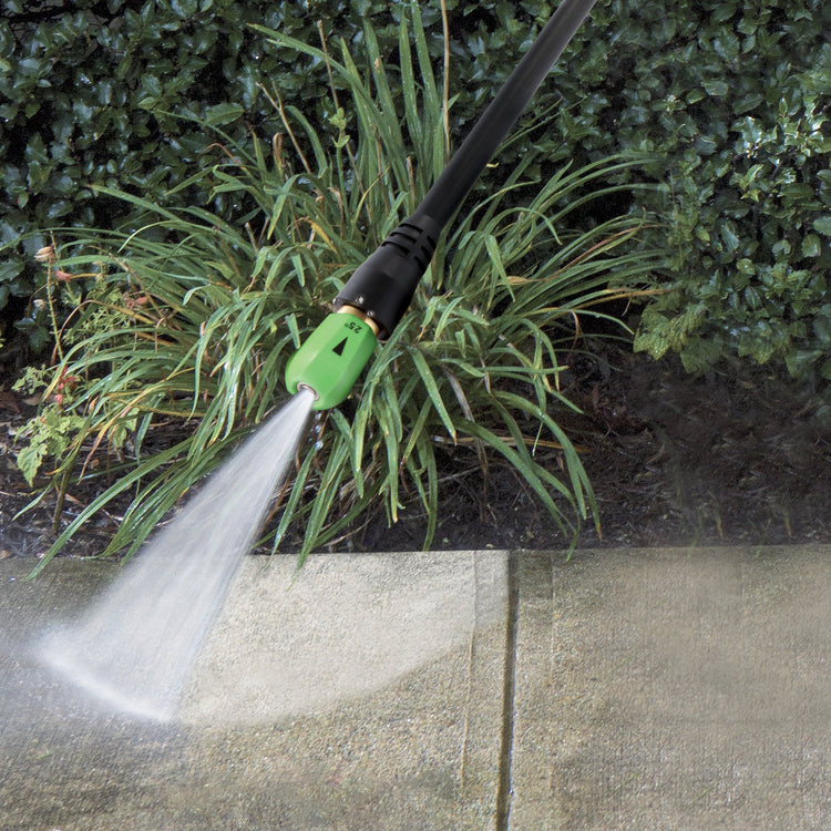 Spray wand with a quick-connect nozzle attached cleaning a sidewalk.