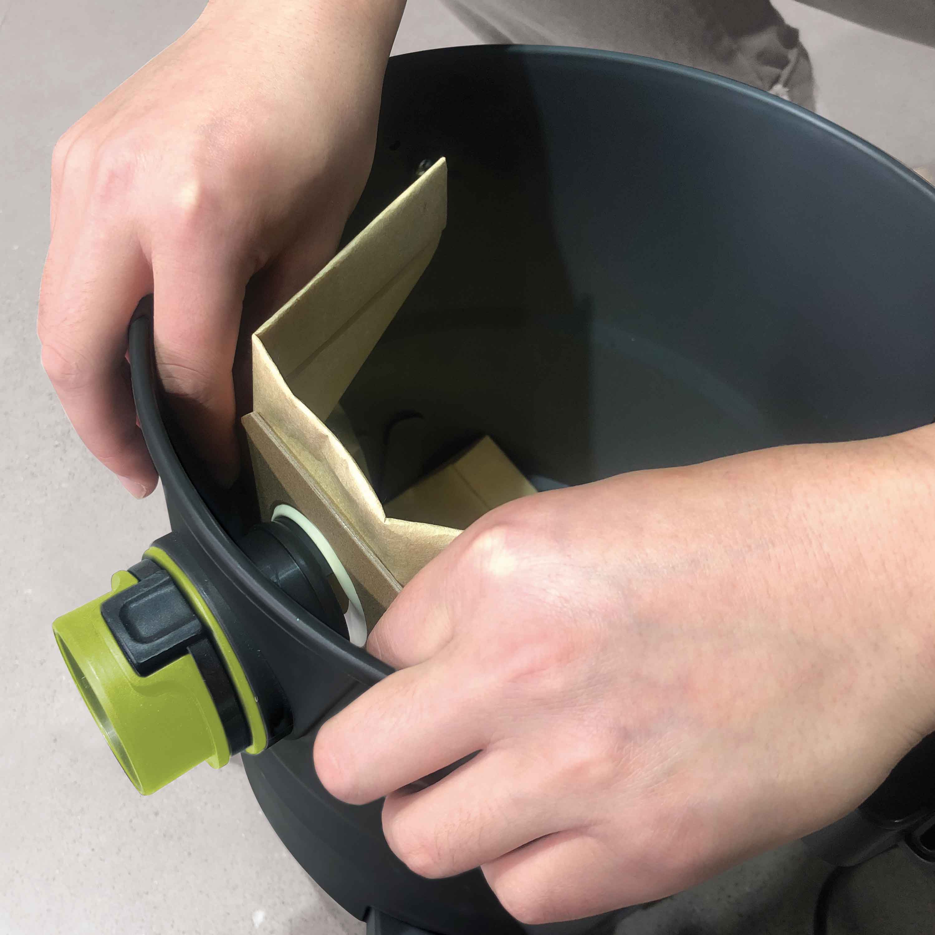 Sun Joe Universal Paper Filter Bag being installed on a 5-gallon Wet/Dry Vacuum.
